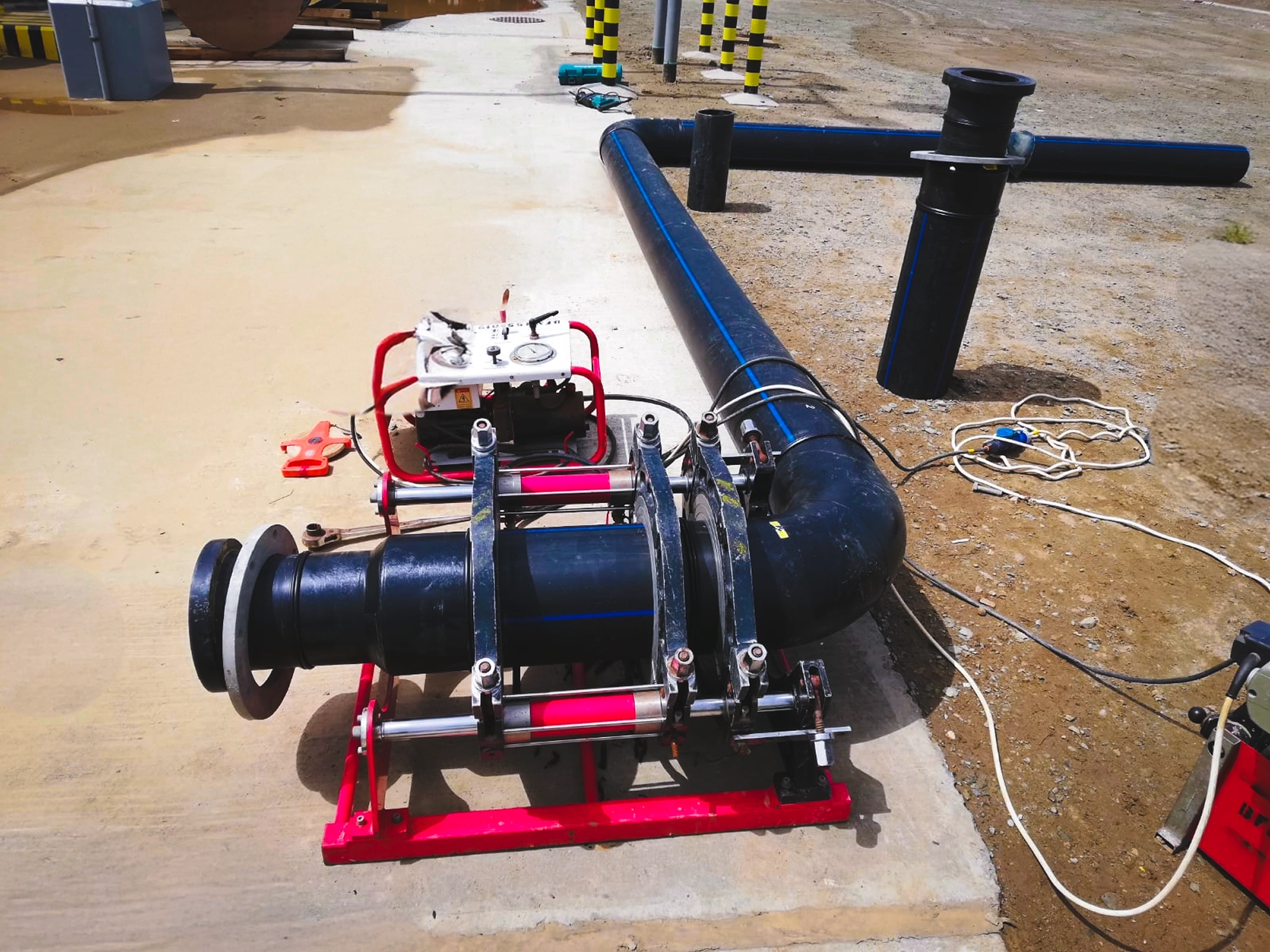 Worker inspecting HDPE valve alignment